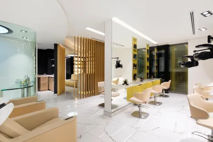 LUME Beauty Atelier salon interior with warm timber and reflective surfaces